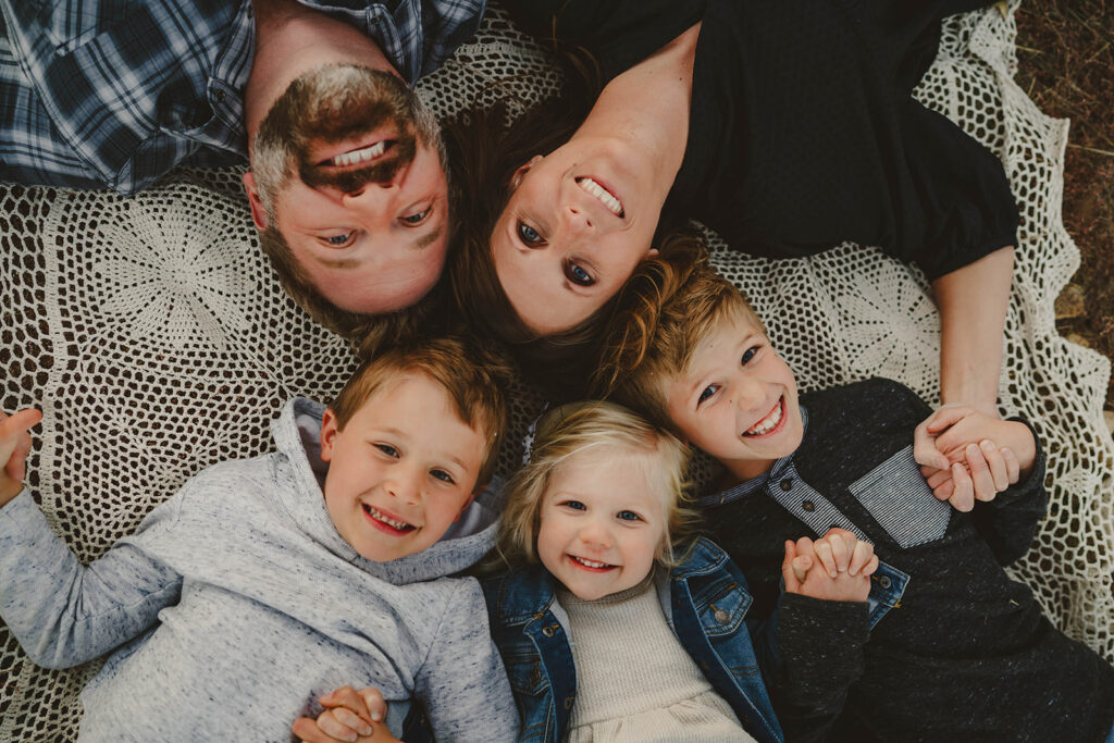 pov shot of denver family on blanket for fall family photos