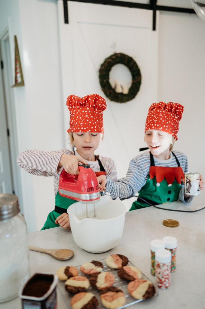 Denver Family Photographer captures brothers making cookies in the kitchen together