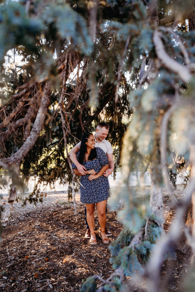 Colorado elopement photographer captures couple standing in trees together