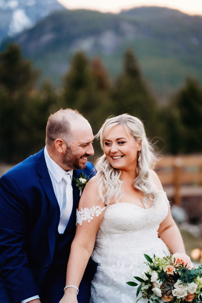Colorado elopement photographer captures bride and groom holding hands during bridal portraits
