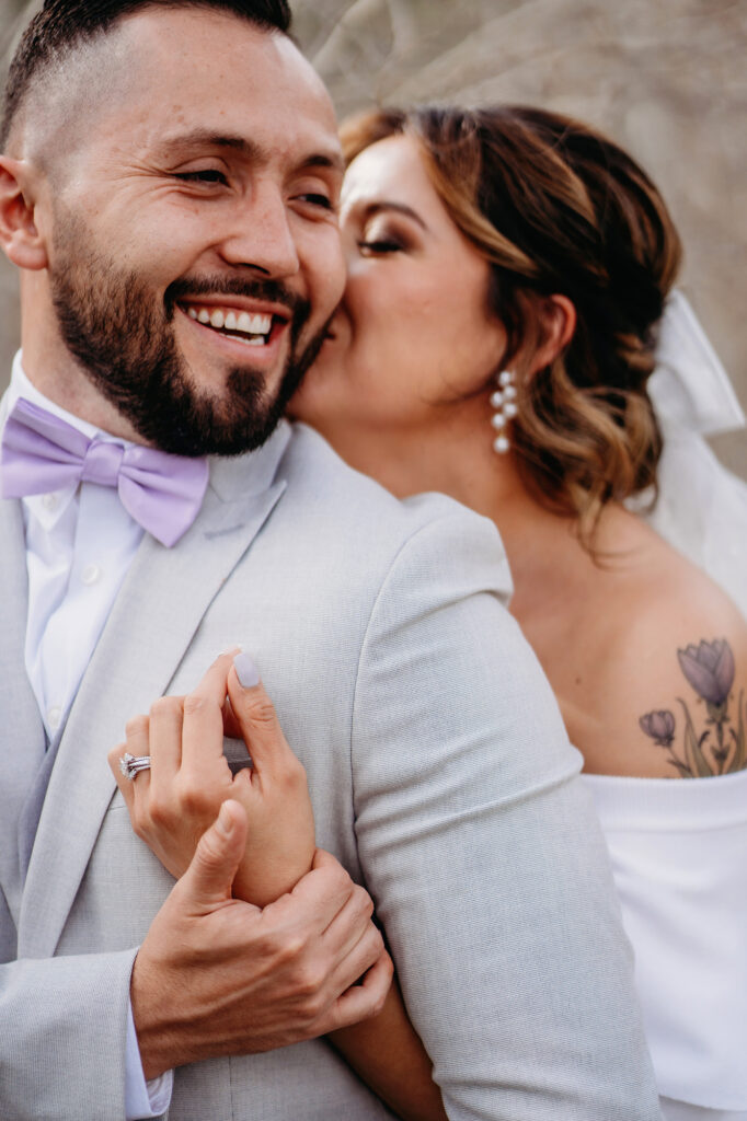 Colorado elopement photographer captures bride hugging groom 