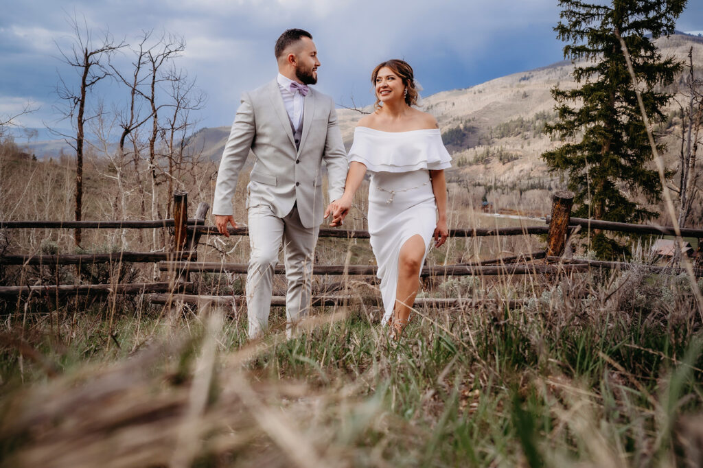Colorado elopement photographer captures bride and groom walking together after elopement