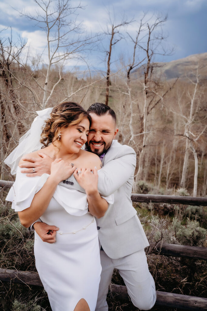 Colorado elopement photographer captures couple hugging after intimate elopement ceremony