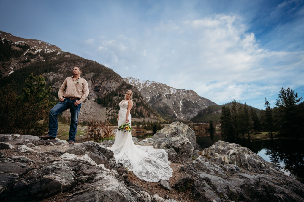 Denver wedding photographer captures couple standing on rock during bridal portraits