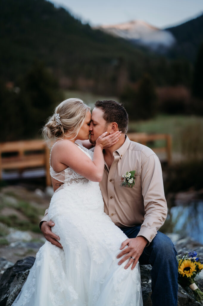 Denver wedding photographer captures bride kissing groom during bridal portraits