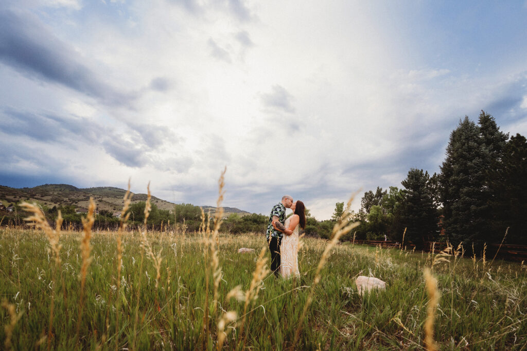 Denver wedding photographer captures couple kissing during destination Colorado engagements