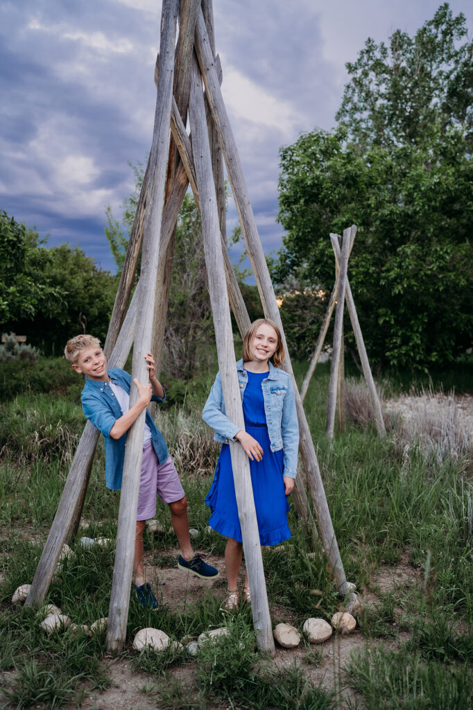 Denver family photographers capture kids playing in teepee