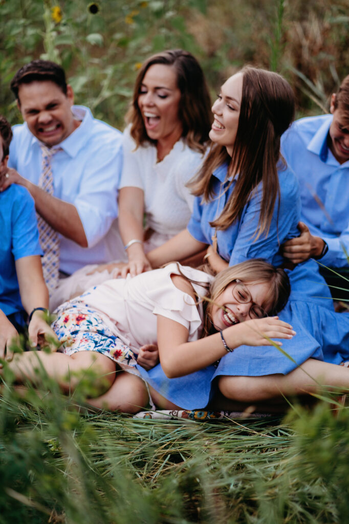 Denver Family Photographers capture family laughing together during outdoor family portraits