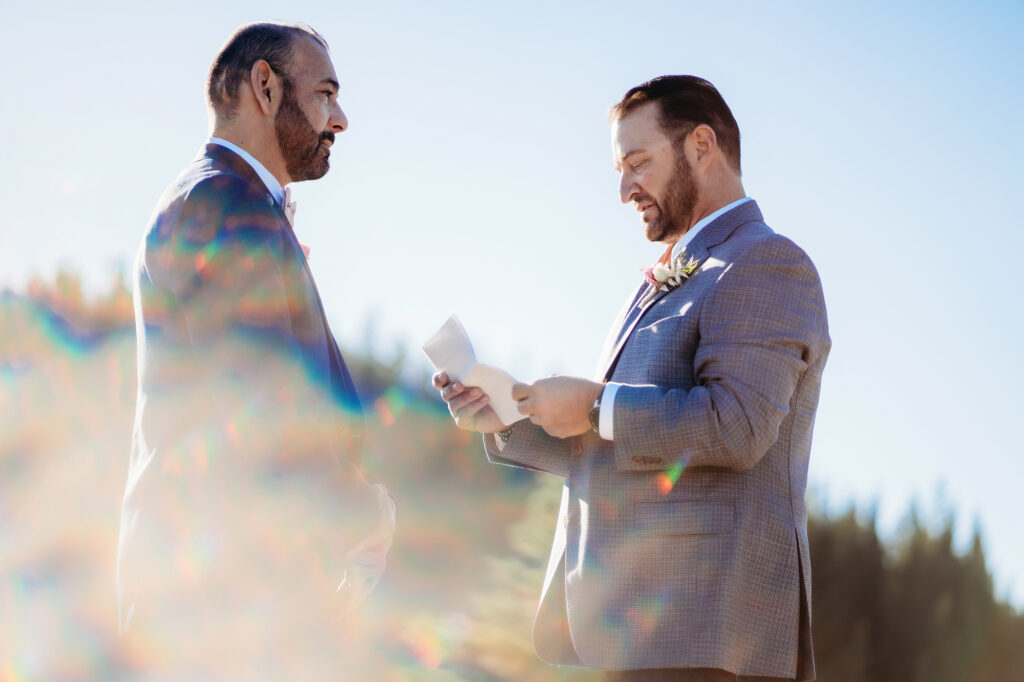 Colorado elopement photographer captures couple reading vows during their private elopement