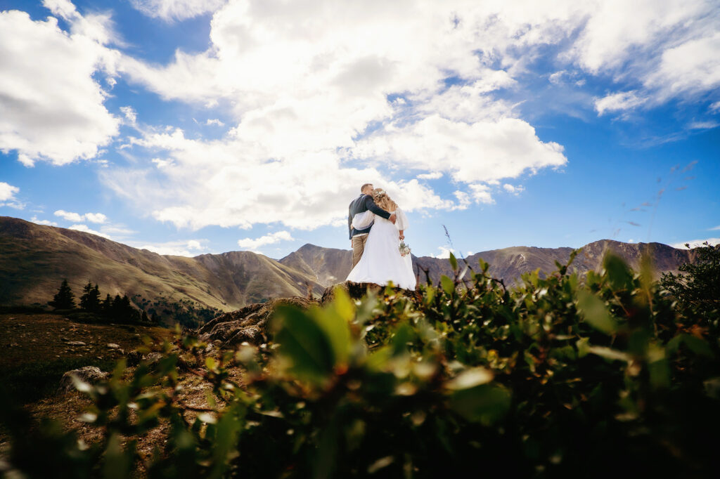 Colorado elopement photographer captures bride and groom kissing 