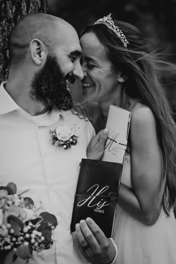 Colorado elopement photographer captures couple laughing after reading vows