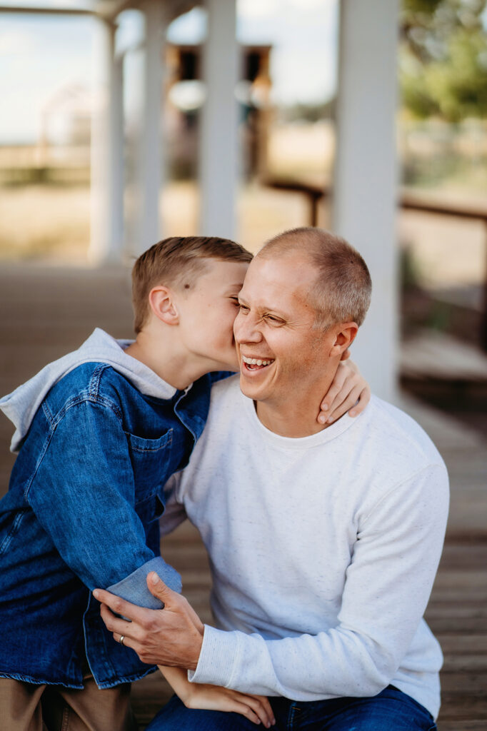 Denver family photographer captures son kissing father's cheek