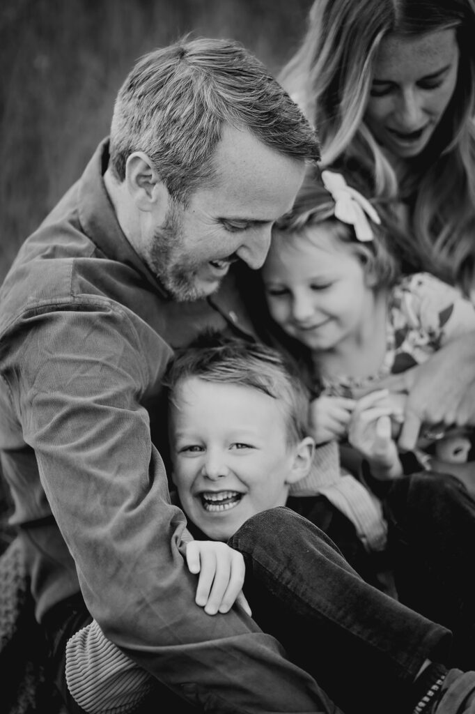 Denver Family Photographers capture father tickling kids