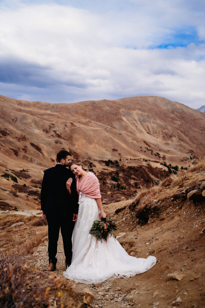 Colorado Elopement Photographer captures bride and groom hugging