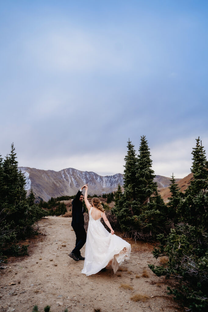 Colorado elopement photographer captures couple spinning during portraits