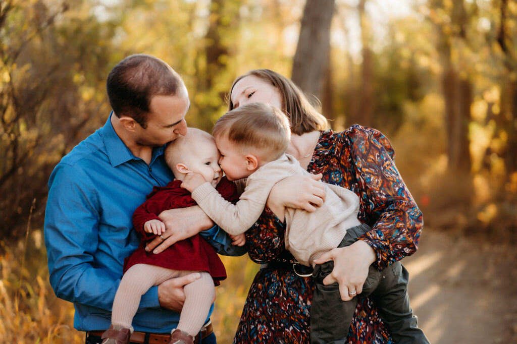 Denver Family Photographers capture daughter kissing sister