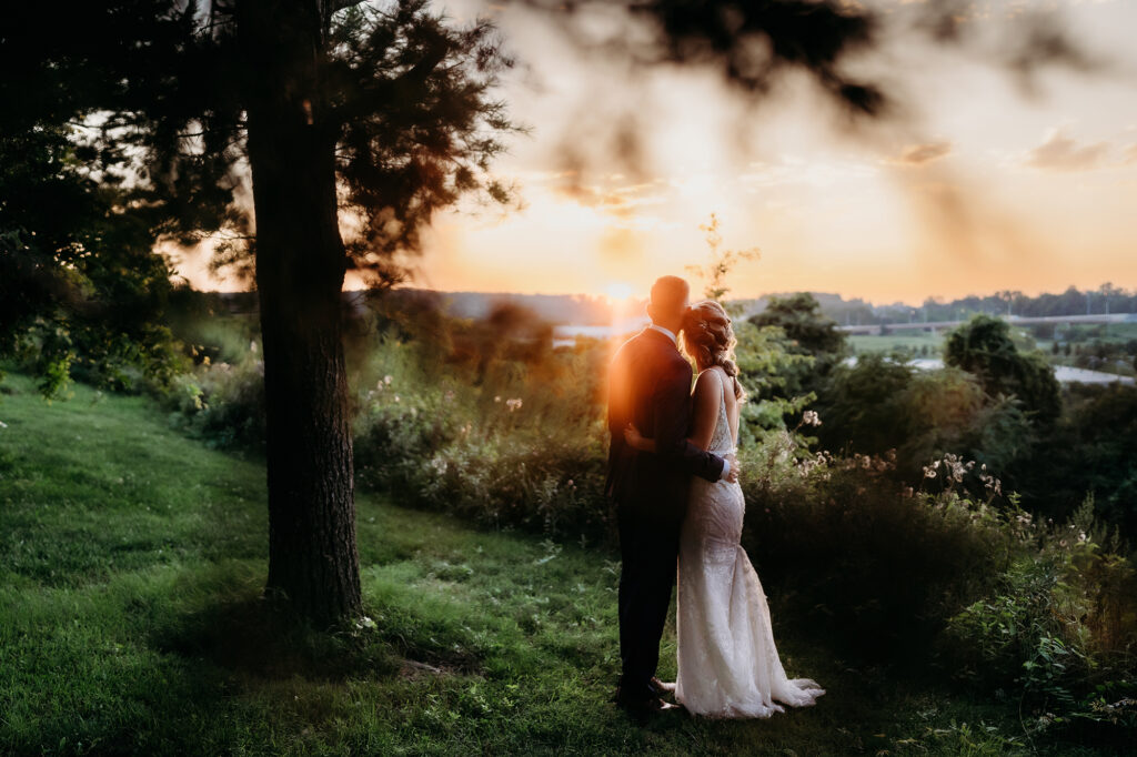 Colorado elopement photographers capture bride and groom embracing during golden hour portraits