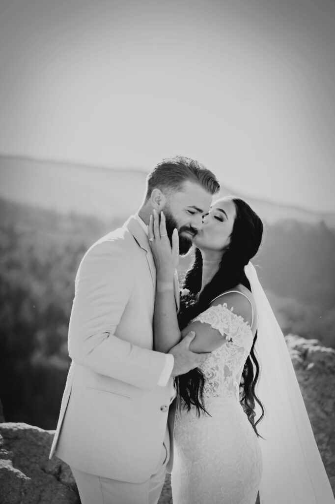 Colorado elopement photographer captures bride kissing groom's cheek