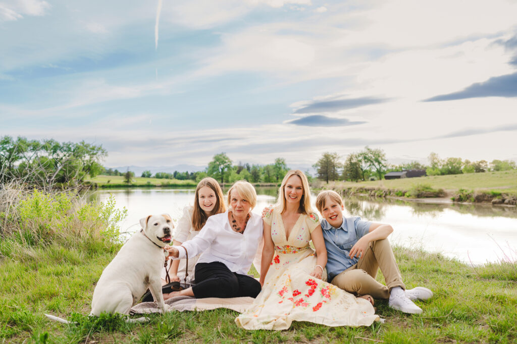 Denver Family Photographers capture family sitting together on picnic