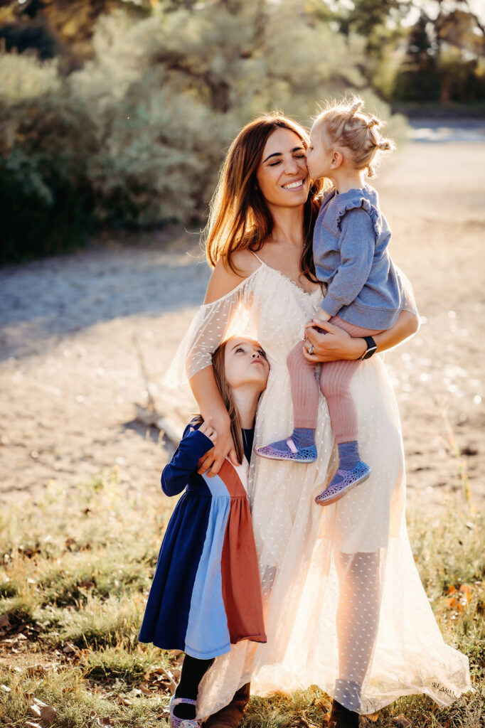 Denver family photographers capture mother holding children