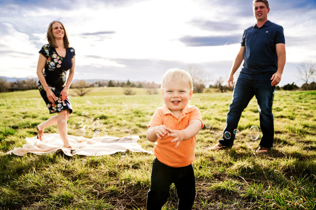 Denver family photographer captures mother and father chasing baby