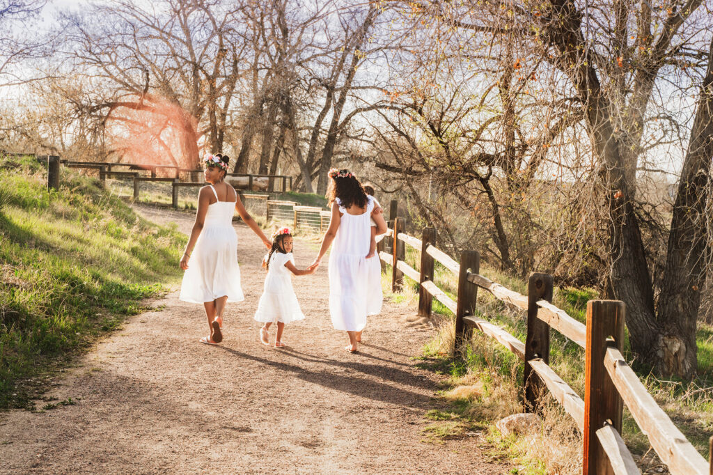 Denver family photographers capture family walking together holding hands