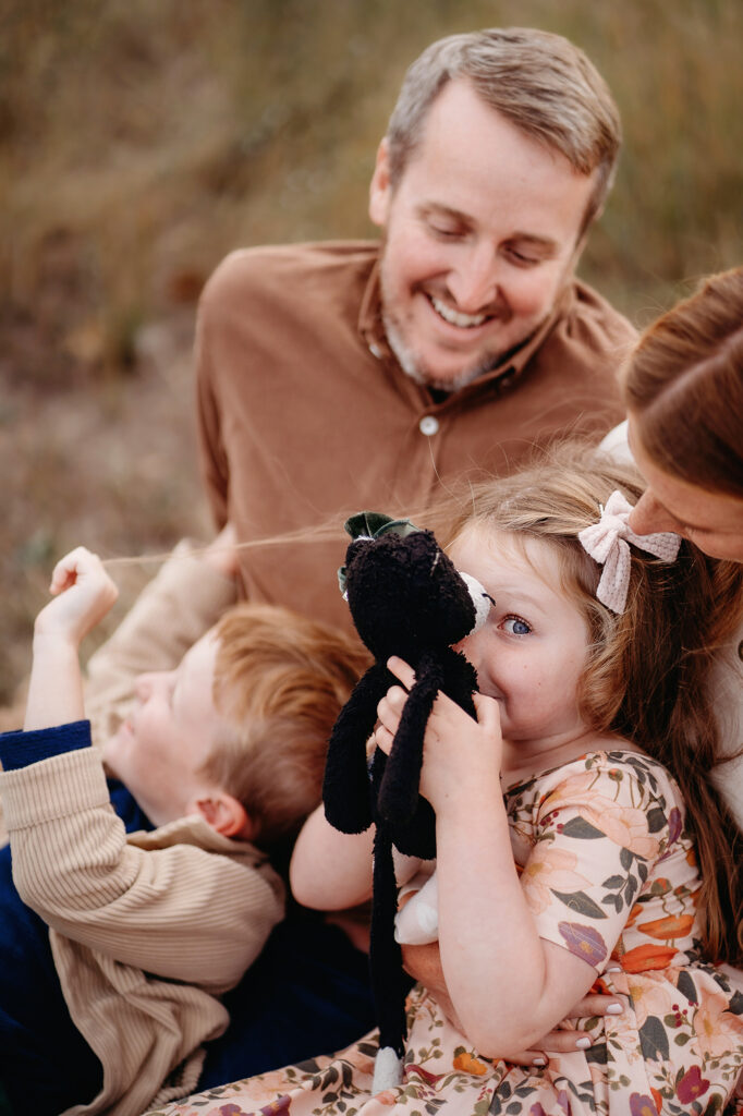 Denver Family Photographers capture father playing with children during child centric session