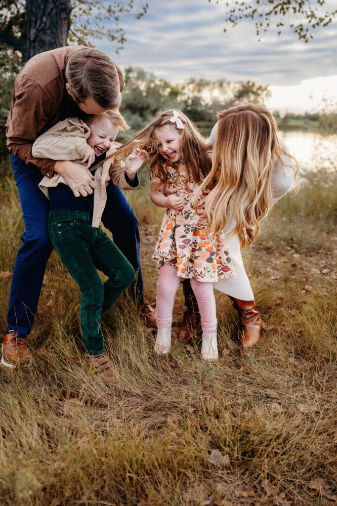 Denver family photographers capture parents tickling children