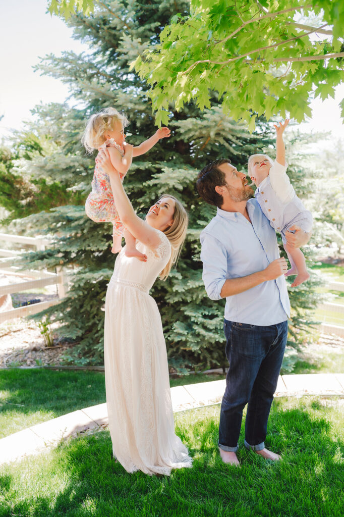 Denver family photographers capture mother and father playing with children