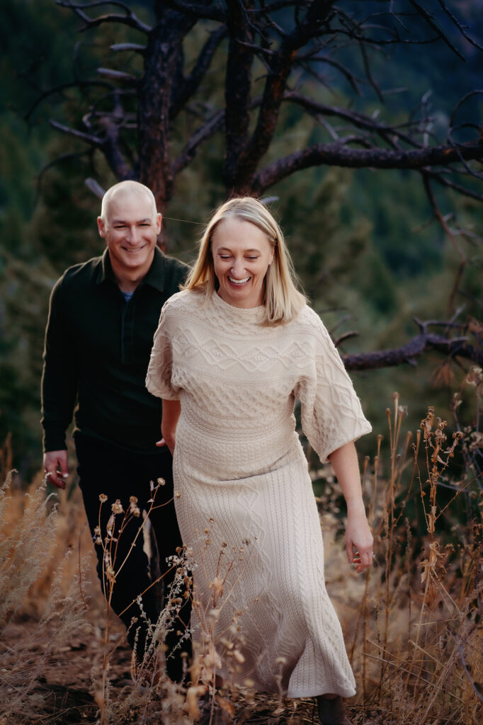 Denver family photographer captures woman leading husband through forest