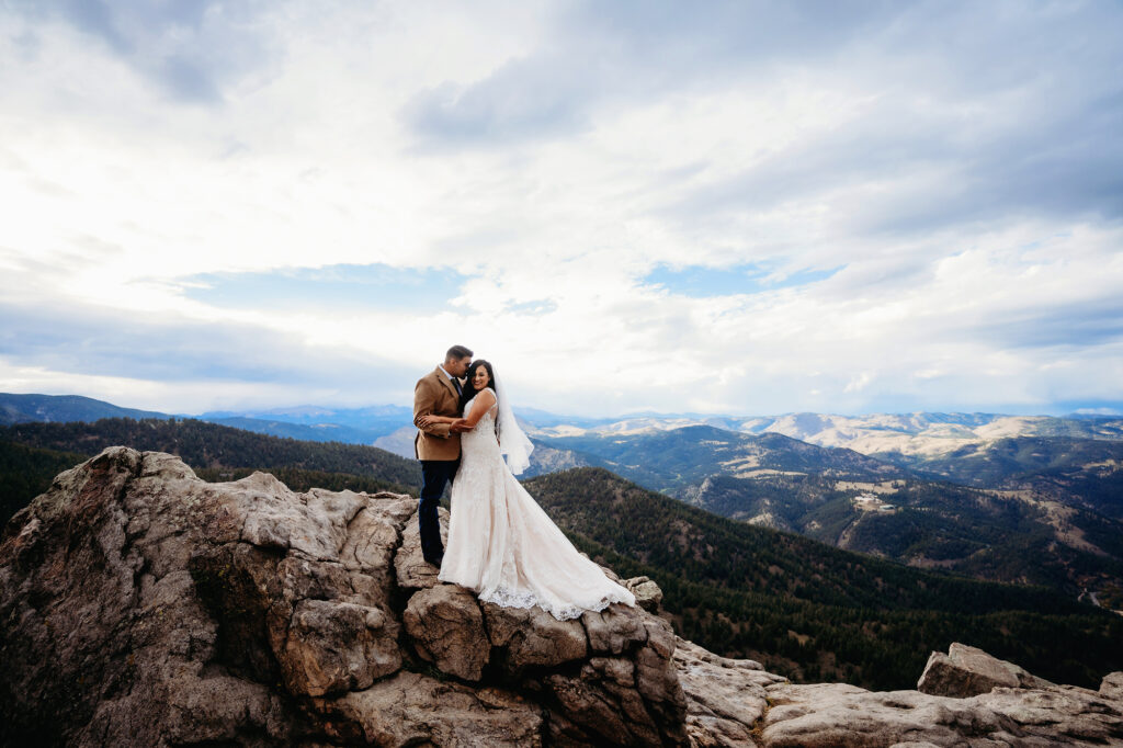 Colorado elopement photographer captures couple overlooking view after elopement ceremony