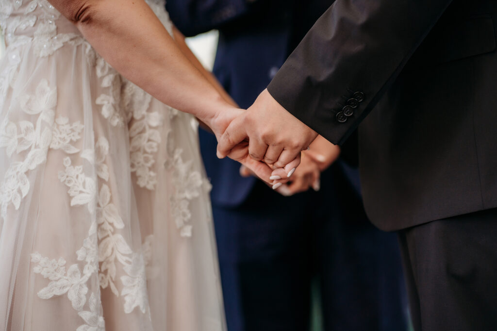 Colorado elopement photographer captures bride and groom holding hands during Colorado elopement