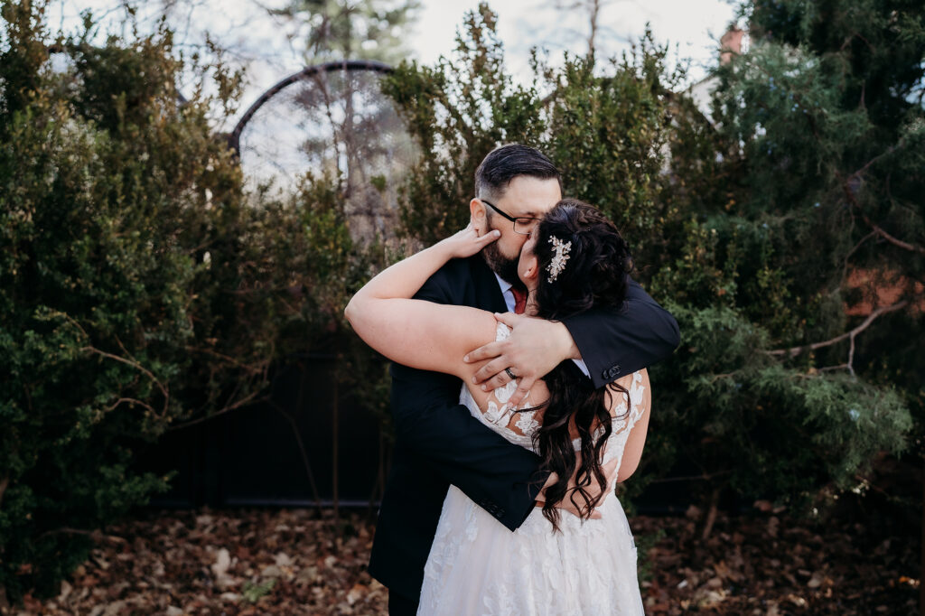 Colorado elopement photographer captures bride and groom kissing in forested area after Colorado elopement