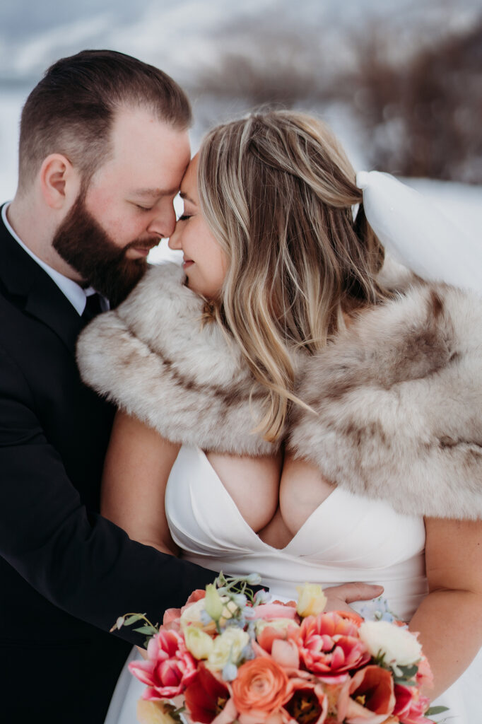 Colorado wedding photographer captures couple touching foreheads during bridal portraits