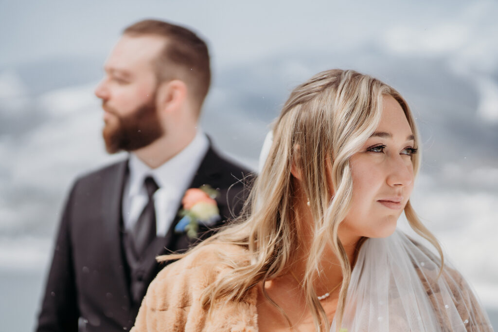 Wedding Photographer captures bride and groom looking in opposite directions
