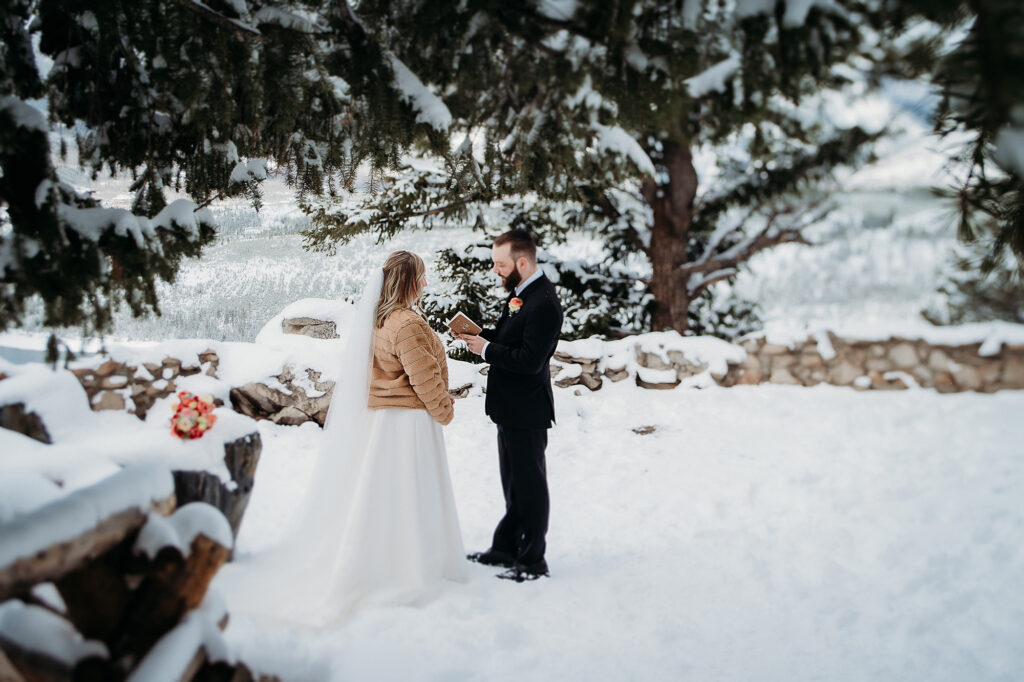 Colorado wedding photographer captures bride and groom reading handwritten vows