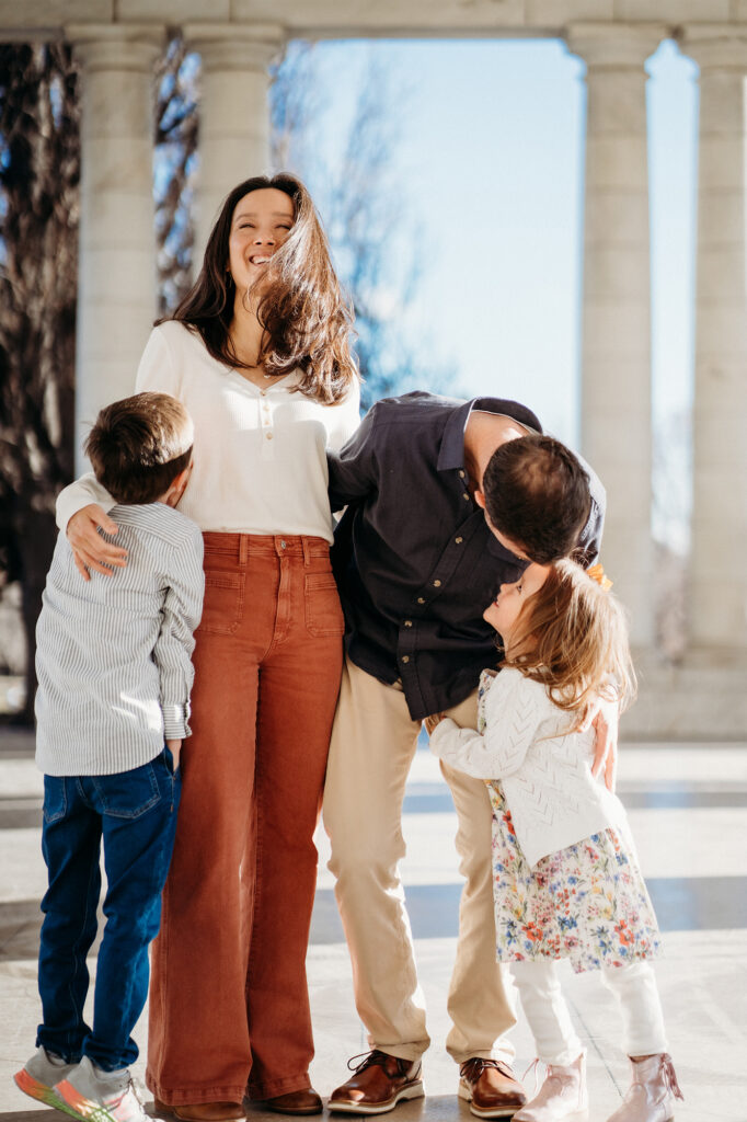 Denver family photographer captures children hugging parents