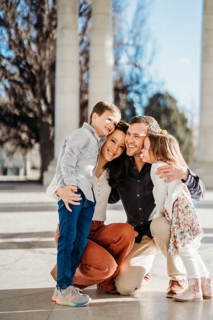 Denver Family Photographer captures family hugging and smiling 