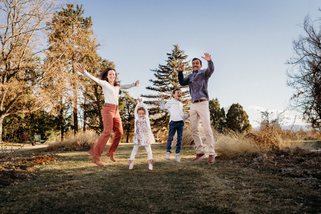 Denver Family Photographer captures family jumping and playing together 