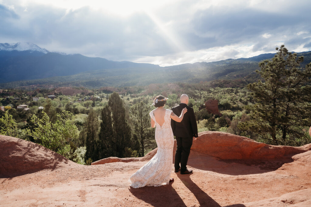 Denver Wedding Photographer captures bride tapping groom's shoulder before first look