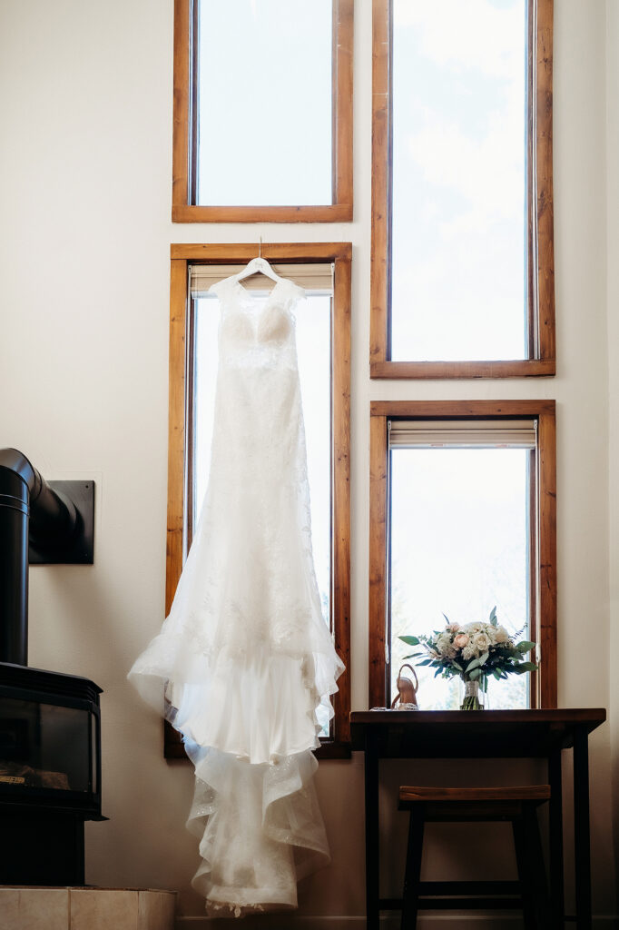 Colorado Elopement Photographer captures wedding dress hanging up before Classic Colorado elopement