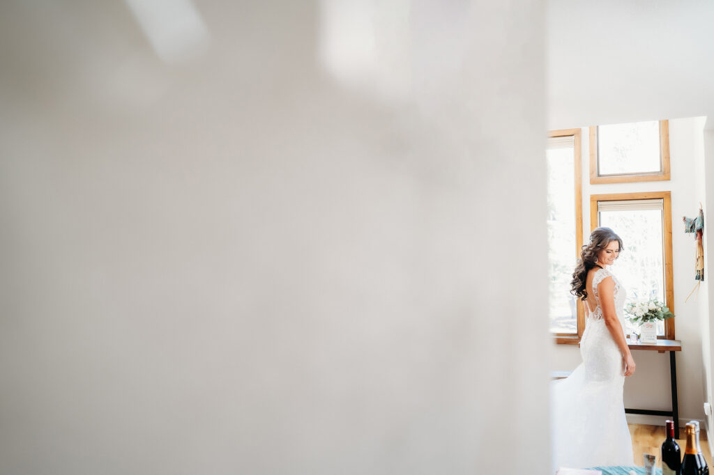 Colorado Elopement Photographer captures bride wearing wedding dress moments before classic elopement ceremony