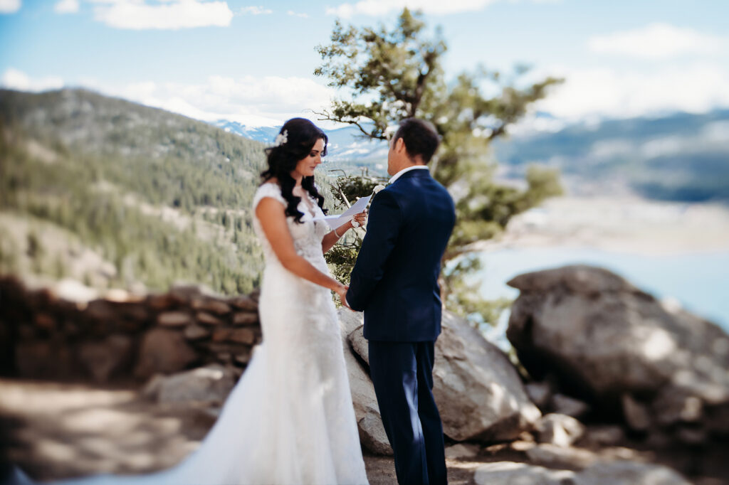 Colorado Elopement Photographer captures bride reading vows to groom