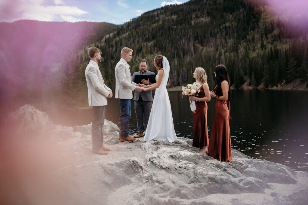 Colorado Elopement Photographer captures close up of ceremony on boulder in Colorado 