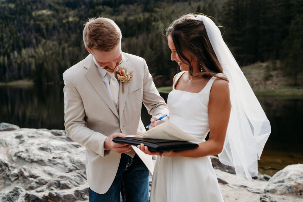 Colorado Elopement Photographer captures couple signing marriage license