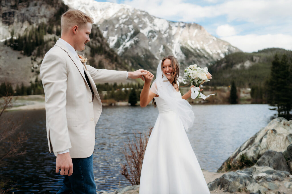 Colorado Elopement Photographer captures groom spinning bride 