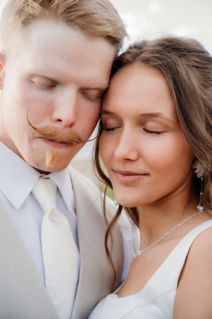 Colorado Elopement Photographer captures bride and groom with closed eyes during bridals