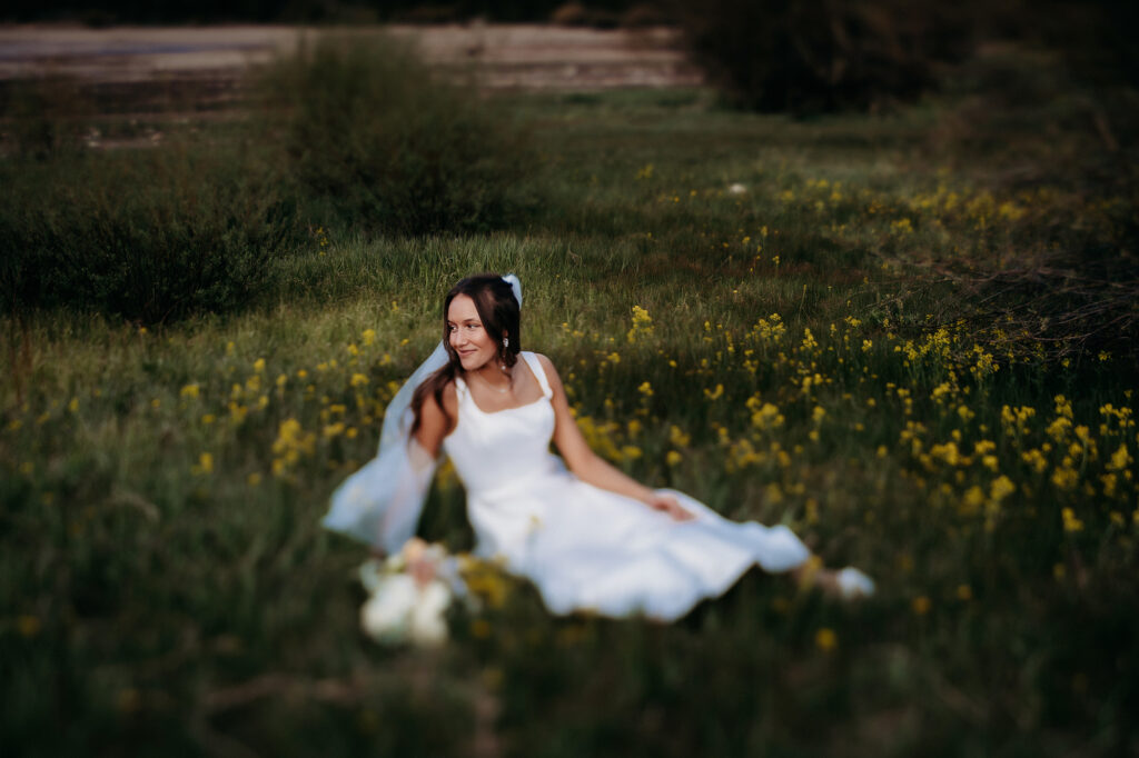 Colorado Elopement Photographer captures bride in grass