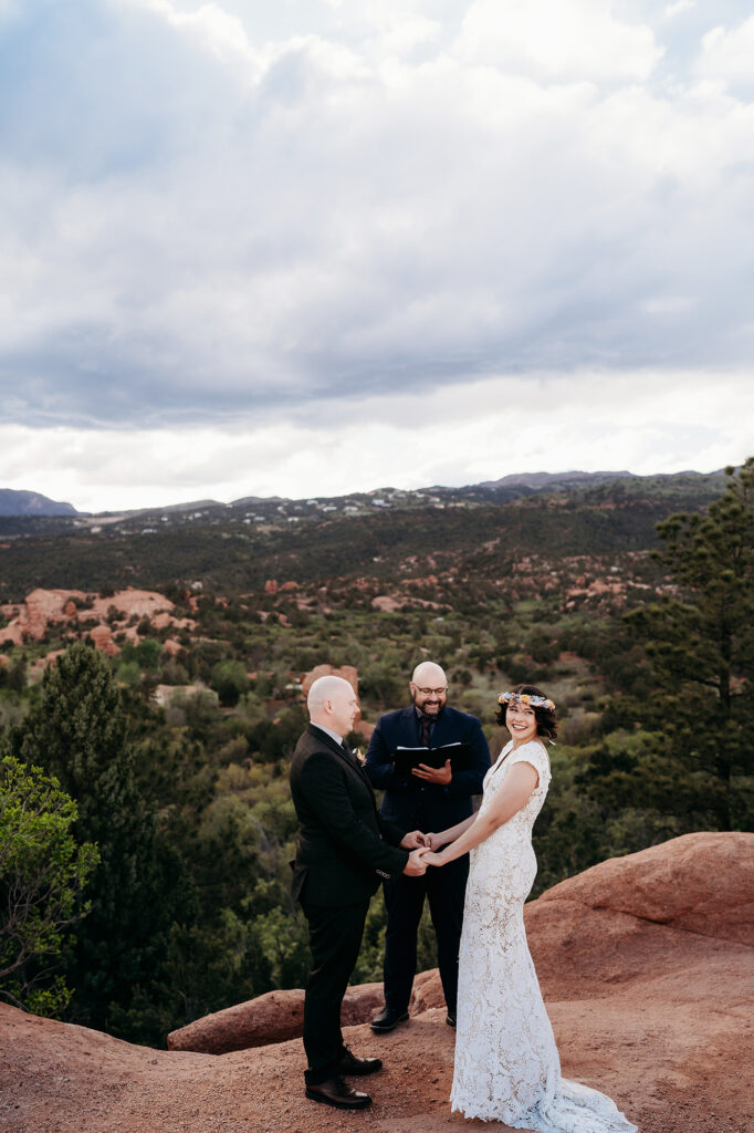 Denver Wedding Photographer captures couple holding hands during intimate elopement ceremony