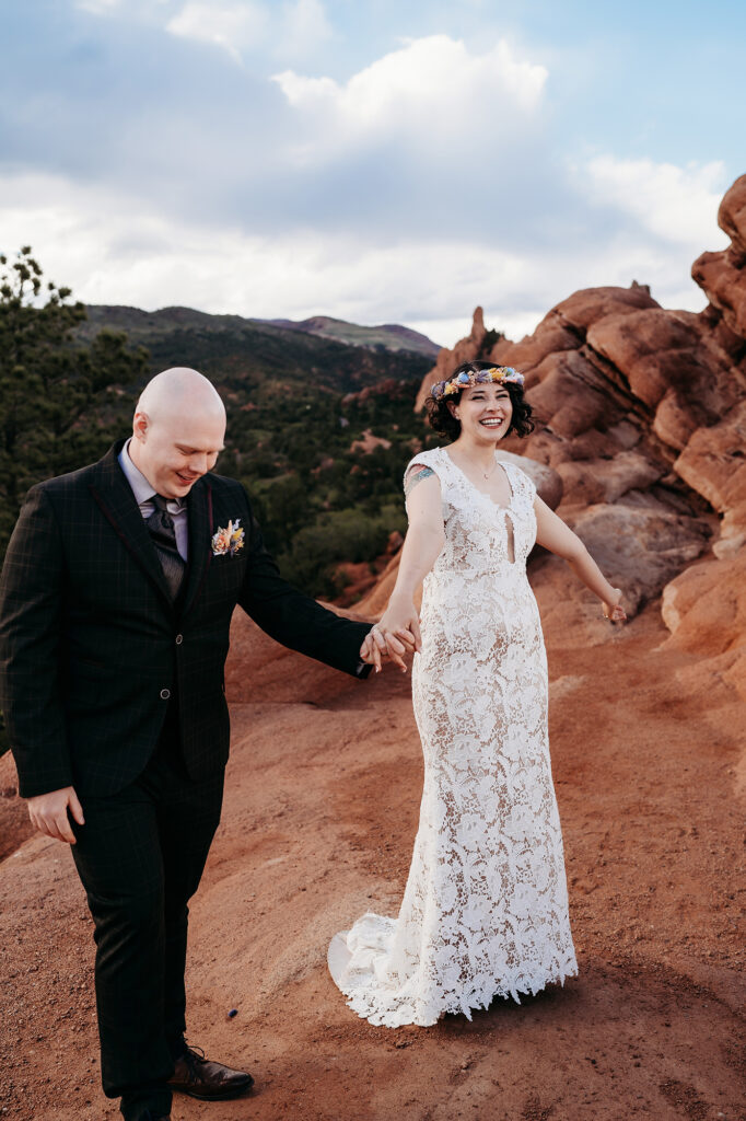 Denver Wedding Photographer captures bride and groom holding hands during bridal portraits